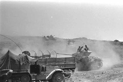 Israeli tanks climbing up a steep hill on the Golan Heights. -GPO 6/10/1967