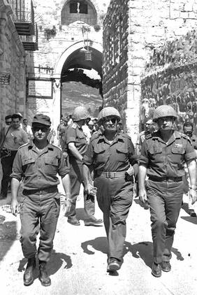 Defense Minister Moshe Dayan, Chief of Staff Yitzhak Rabin and Jerusalem Commander Uzinarkis enter through Lion’s gate into the Old City. -GPO 06/07/1967