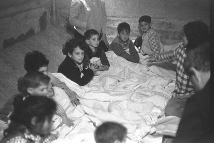 Toddlers taking shelter during shelling of Kibbutz Tel Katzir from Syrian positions in Tawafiq. -GPO 1/1/67