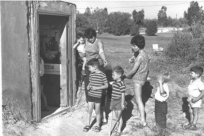 Toddlers with their nurses outside the entrance to underground shelter at Kibbutz Nahal Oz. -GPO 5/29/1967